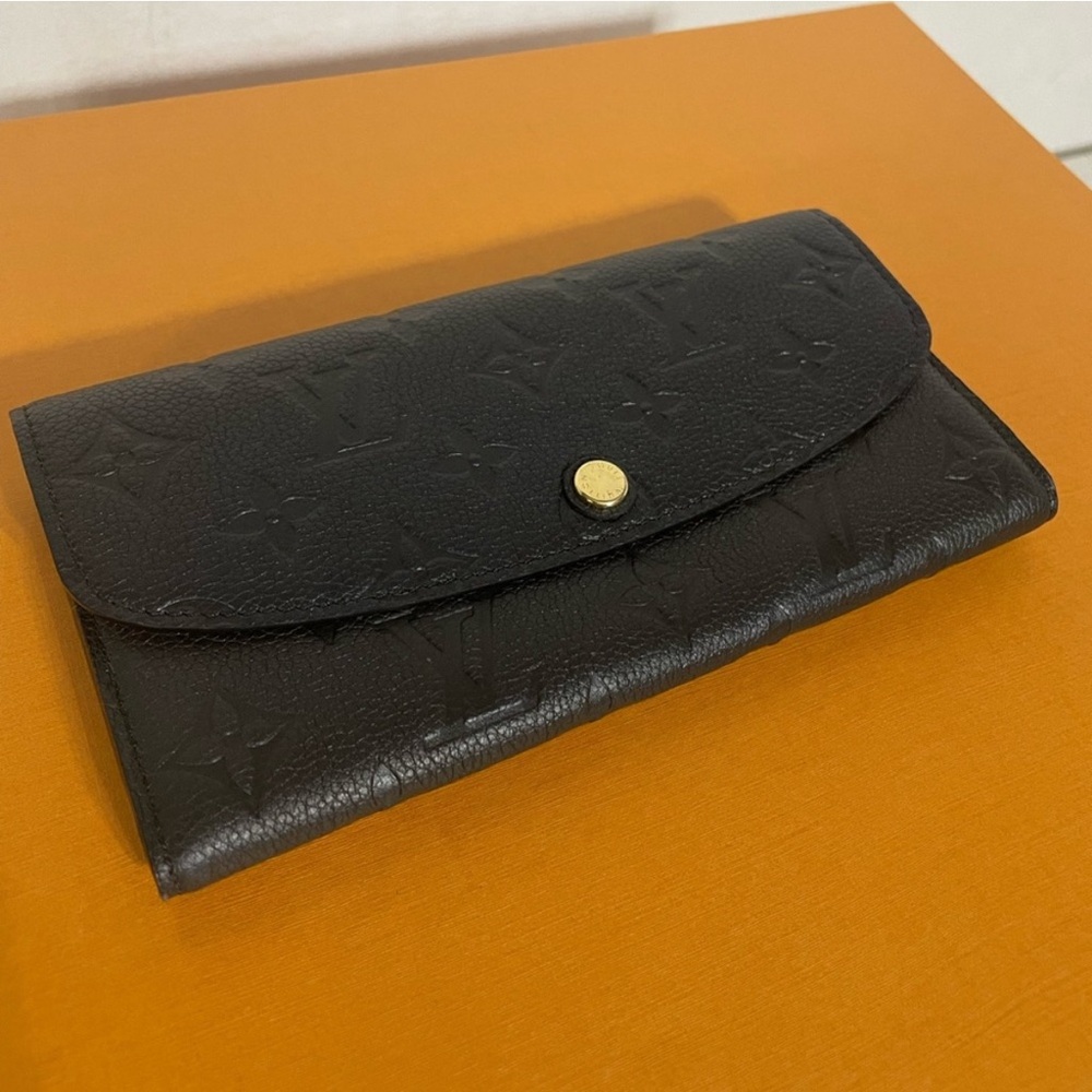 Authentic Louis Vuitton Emilie Monogram Empreinte Leather Wallet in black